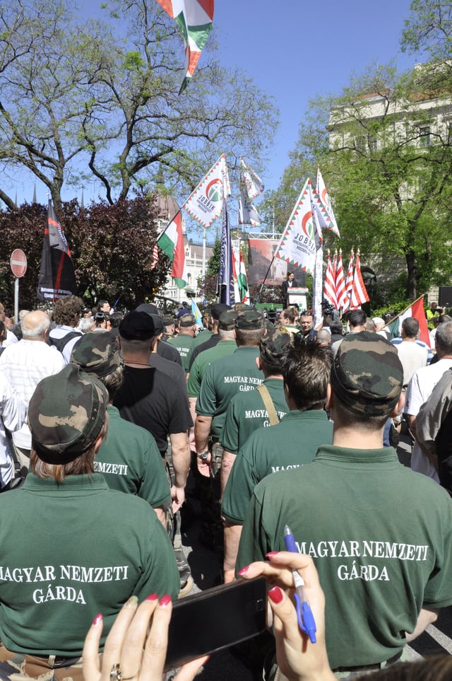 Members of the New Hungarian Guard stand at a Jobbik rally against a gathering of the World Jewish Congress in Budapest, 4 May 2013