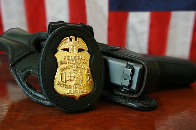 FBI badge and service pistol, a Glock Model 22,.40 S&W caliber