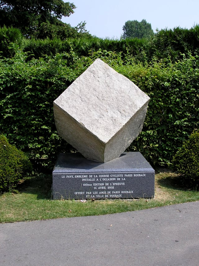 Cobblestone Emblem of Paris-Roubaix, Donated on the 100th anniversary by 'Les Amis de Paris-Roubaix' and 'La Ville de Roubaix' 50°40′43″N 3°12′17″E