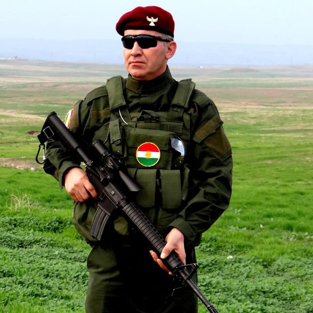 A Peshmerga soldier with his modified M16A4 rifle