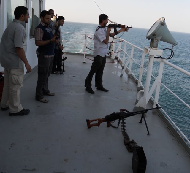 Private guard escort on a merchant ship providing security services against pirates.