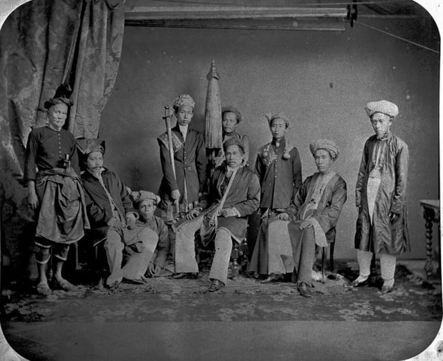 The reigning elite of the Riau-Lingga Sultanate, together with the Sultan (being seated, in the middle) as depicted in this photograph taken in 1867. The administrative class of Riau-Lingga are known to be strict adherents of Sufi Tariqa, this resulted various laws and legal enactments based on Islamic principles to be strictly observed throughout the archipelago kingdom. The sultanate would be abolished almost half a century later in 1911 by the Dutch powers, following a strong independence movement manifested in the nation against the colonial government.