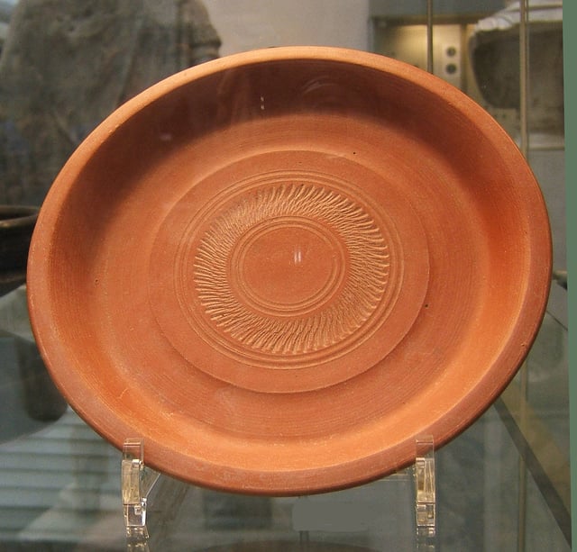 A typical plain berber Red Slip dish with simple rouletted decoration, 4th century