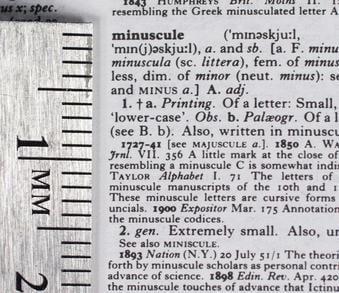 Part of an entry in the 1991 compact edition, with a centimetre scale showing the very small type sizes used.