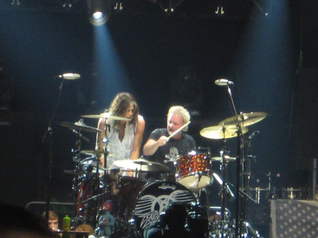 Steven Tyler and Joey Kramer playing drums together at an Aerosmith concert in Chicago, Illinois on June 22, 2012