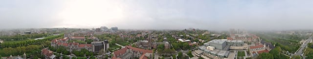 The campus of the University of Chicago, from the top of Rockefeller Chapel, the Main Quadrangles can be seen on the left (West), the Oriental Institute and the Becker Friedman Institute for Research in Economics can be seen in the center (North) and the Booth School of Business and Laboratory Schools can be seen on the right (East), as the panoramic is bounded on both sides by the Midway Plaisance (South).