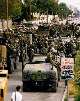 Marines disembark in Compton from their Humvees and trucks on May 2, 1992