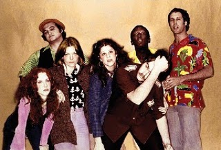 The original 1975 cast, from left to right: Laraine Newman, John Belushi, Jane Curtin, Gilda Radner, Dan Aykroyd, Garrett Morris, and Chevy Chase