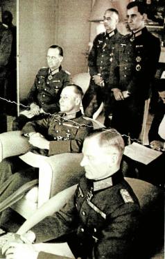 A meeting between the military resistance's inner circle and Rommel, Mareil-Marly, 15. May 1944. From left, Speidel - behind, Rommel - center, von Stülpnagel - front. The officer standing left is Rudolf Hartmann. The others are unknown.