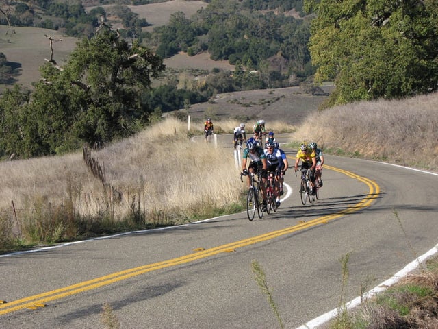 A paceline of drafting cyclists while ascending Mount Hamilton in Santa Clara county.