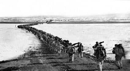 Chinese forces cross the frozen Yalu River.