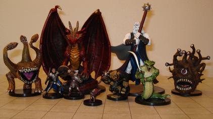 Dungeons & Dragons miniature figures. The grid mat underneath uses one-inch squares.