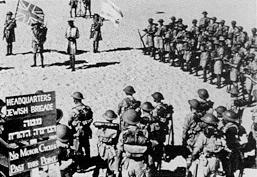 Jewish Brigade headquarters under the Union Flag and Jewish flag.