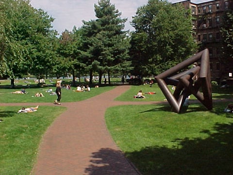 The "BU Beach" is a linear strip of land sandwiched between the main BU campus and busy Storrow Drive, and is used as an outdoors space to relax and sunbathe in good weather.