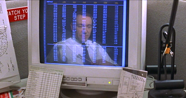 Lester's reflection in the monitor resembles a man in a jail cell, evoking director Sam Mendes's themes of imprisonment and escape or "liberation".