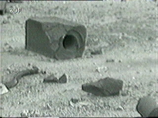 Lumps of graphite moderator ejected from the core; the largest lump shows an intact control rod channel