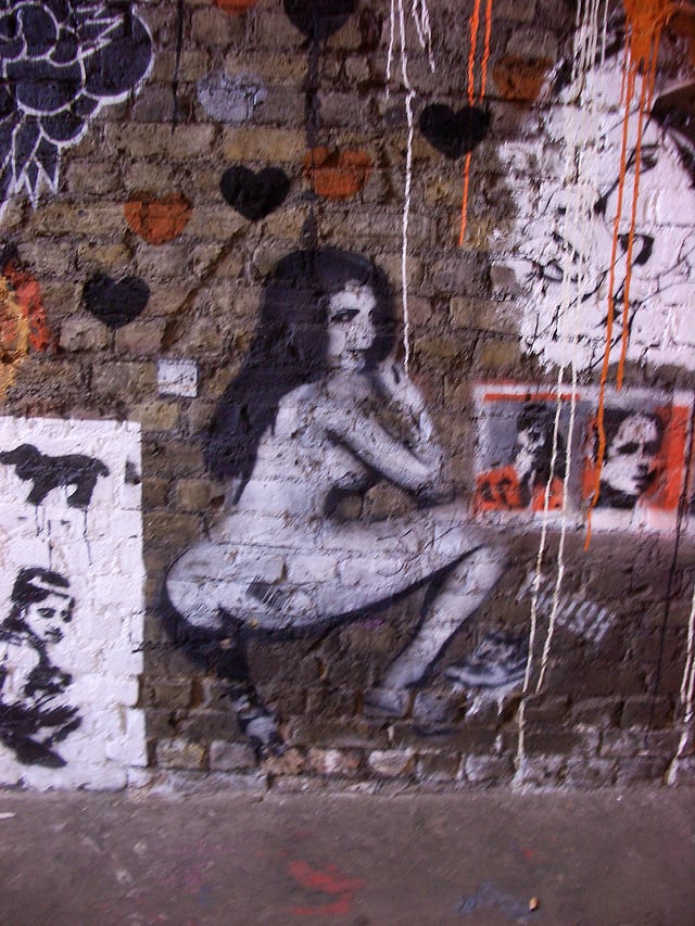 Stripper archetype represented in graffiti on a street in London, England