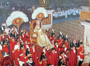 Pope Pius XII, wearing the traditional 1877 Papal tiara, is carried through St. Peter's Basilica on a sedia gestatoria