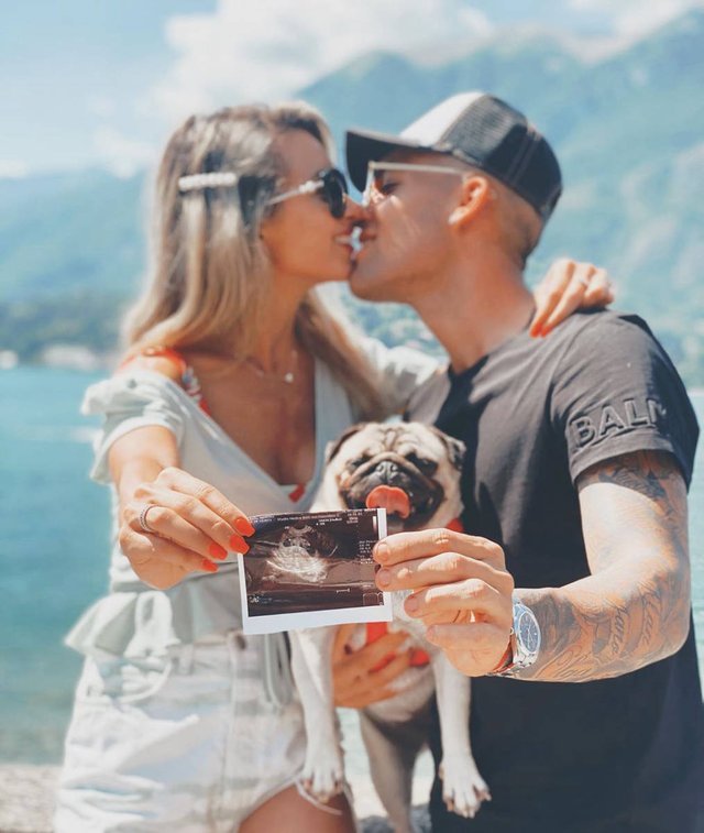 Gandolfo pictured with her partner announcing being pregnant