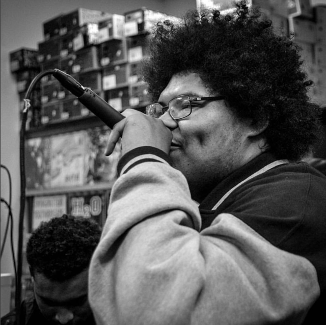 Photo of Afro as an emcee.