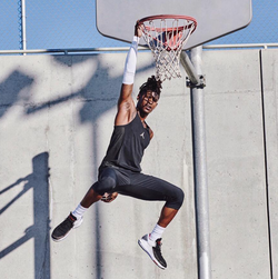 Aubrey Ball dunking the basketball.