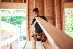 Photo of Austin Wilson while working carpentry.