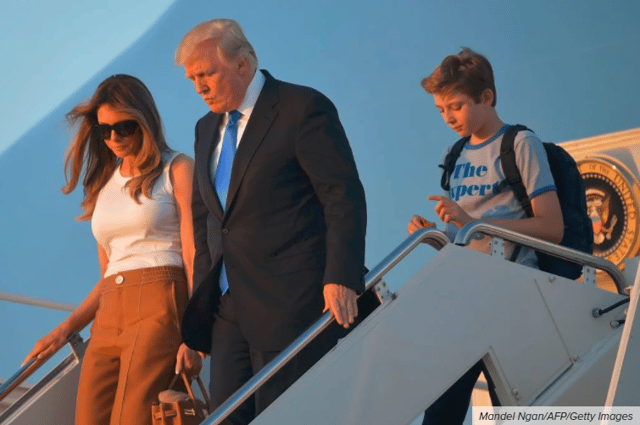 Barron Trump stepping off Air Force One with his family holding a fidget spinner