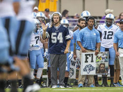 Caleb Pressley wearing a Bruce Carter jersey (Photo: Michael Switzer, DesignWorks)