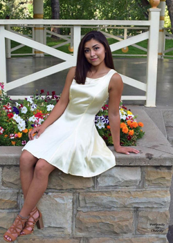 Photo of Casey Jordan wearing a dress as part of her senior class photos.