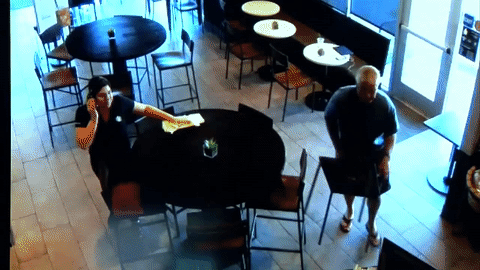 Cregg swinging the chair at the suspect, Ryan Flores.