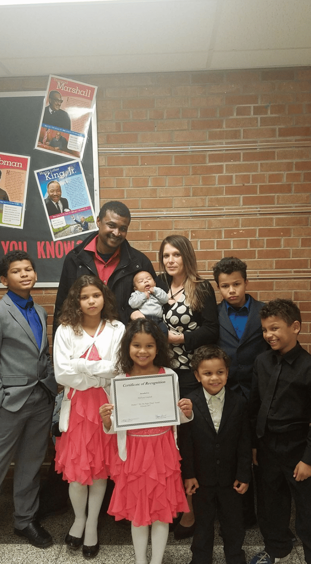 With her family.