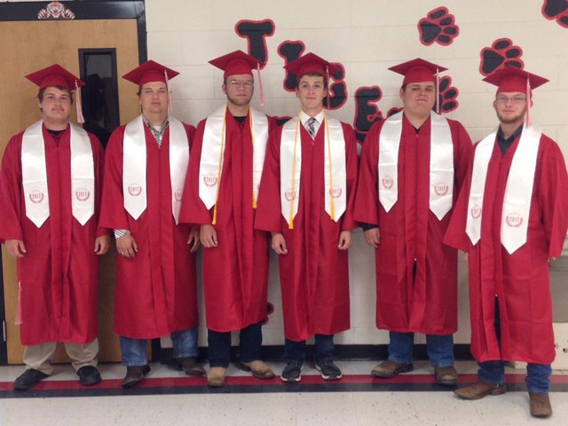 Dalton with his friends graduating from high school