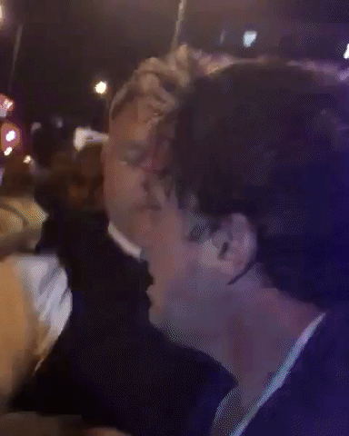 Darren under arrest by police and being yelled at by pedestrians