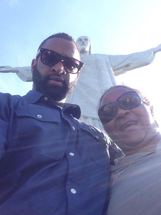 Photo of David Bailey and his mom in front of the Christ the Redeemer (statue) in Brazil