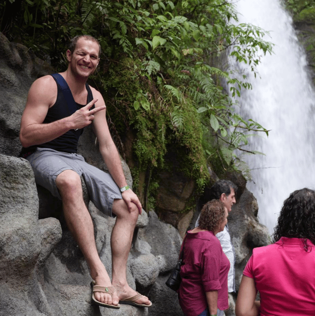 Photo of Dave near some waterfalls.