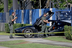 Broward County Sheriff's Office deputies examining the BMW i8 XXXTentacion was fatally shot in