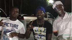 Dedrick Williams, left, Koly P, center