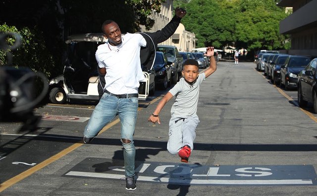 Usain Bolt with Demarjay Smith