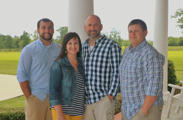 Photo of Dennis with his wife Tammy and two sons, Austin and Dylan