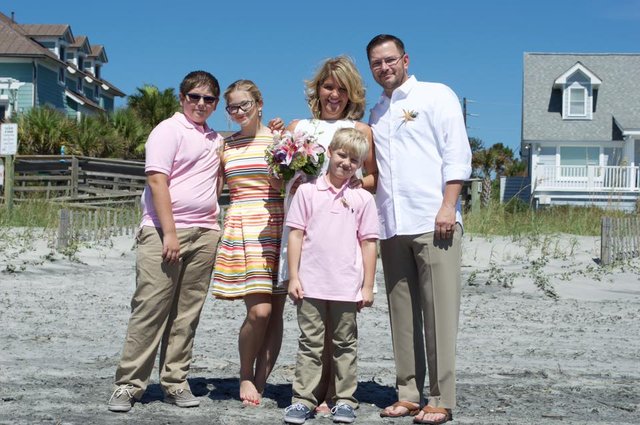 Taking a family picture at the beach