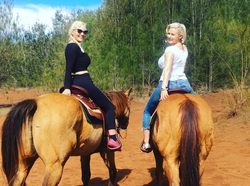 Riding a horse with a friend