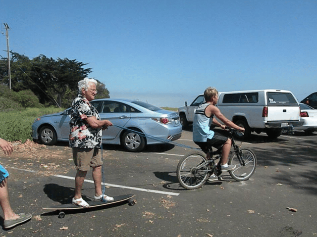 Photo of Gideon riding with his Grandma.