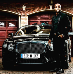 Henry standing next to his Bentley