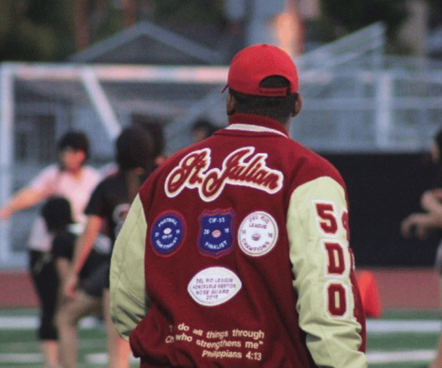 Jeremy wearing his varsity jacket