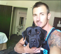 Photo of Jesse Alan Berube with his dog.