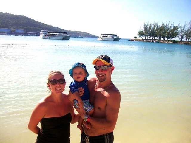 Photo of Jill at the beach with her husband and son