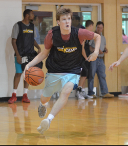John Rigsby playing basketball.
