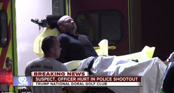 Jonathan Oddi being taken into an ambulance.