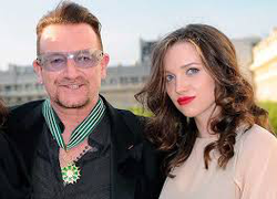 With her father, Bono