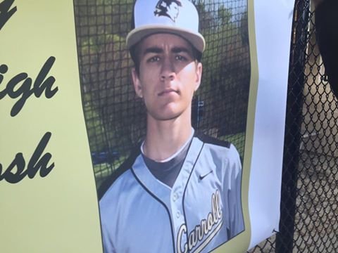 Photo of Josh in his baseball uniform at a vigil at The John Carroll School